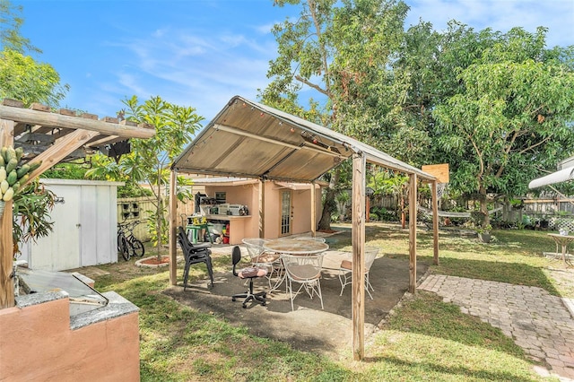 view of patio featuring a storage unit