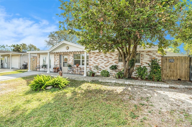 view of front facade with a garage and a front yard