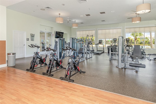 exercise room with ceiling fan