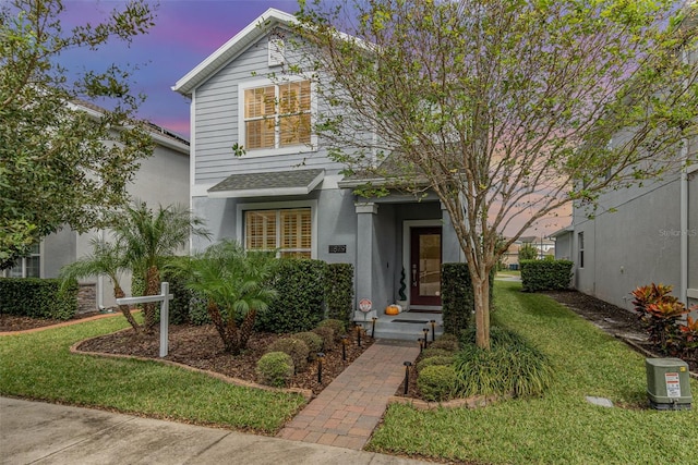 view of front property with a lawn