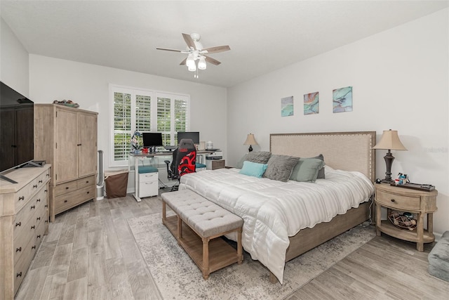 bedroom featuring light wood-type flooring and ceiling fan