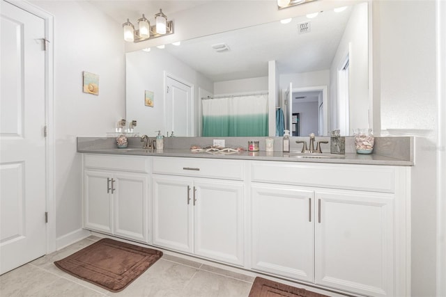 bathroom featuring tile patterned floors and vanity