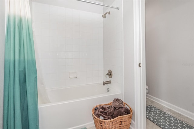 bathroom featuring tile patterned flooring, shower / bath combination with curtain, and toilet