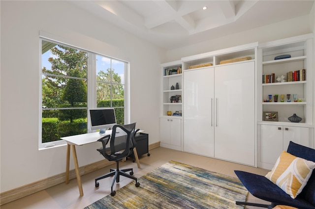 office area featuring beamed ceiling, light tile patterned flooring, coffered ceiling, and plenty of natural light