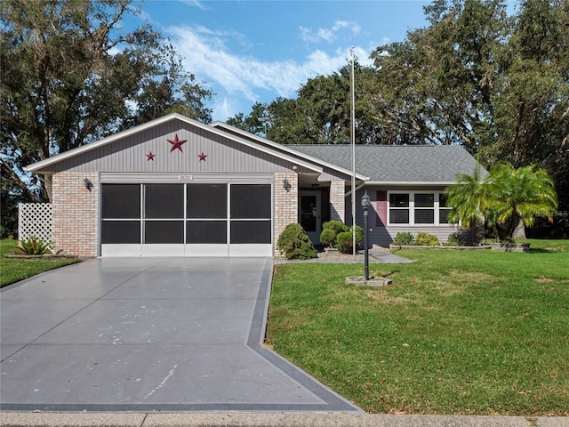 ranch-style home with a garage and a front lawn