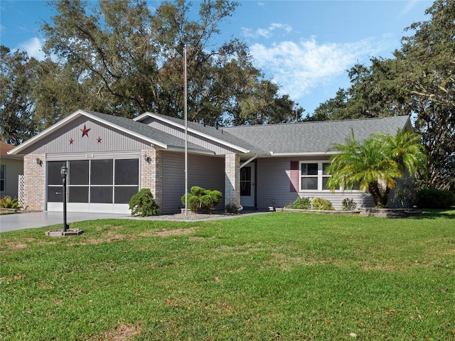 single story home featuring a front yard and a garage