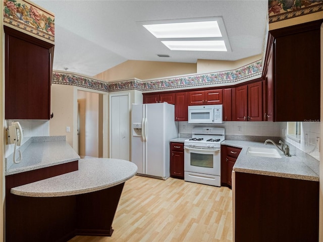 kitchen featuring lofted ceiling, decorative backsplash, light hardwood / wood-style floors, sink, and white appliances