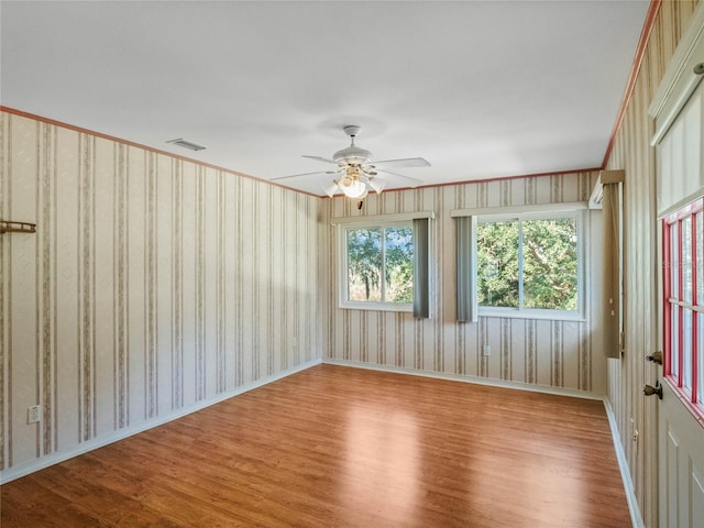 empty room featuring ceiling fan and light wood-type flooring