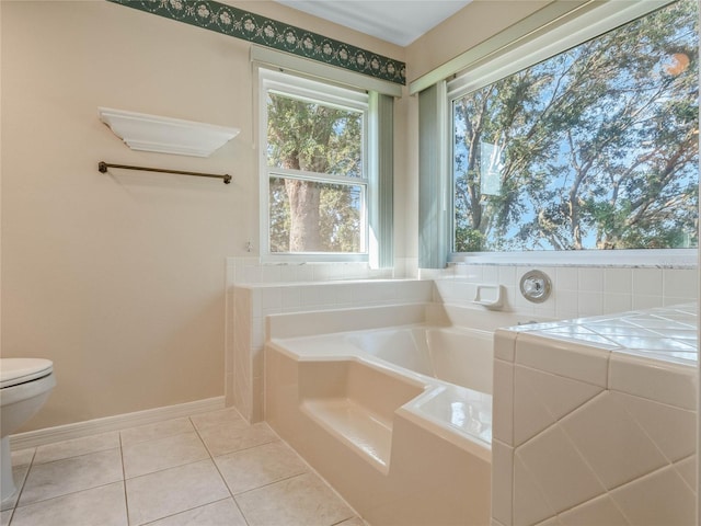 bathroom with a tub, toilet, and tile patterned flooring