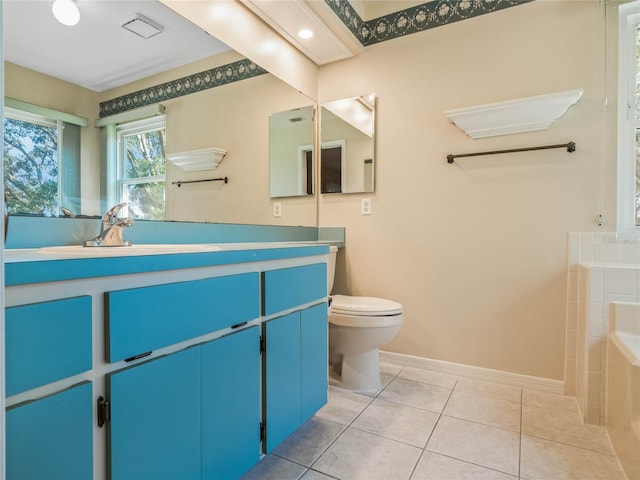 bathroom with vanity, a tub to relax in, tile patterned flooring, and toilet