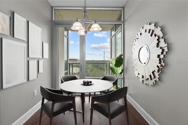 dining room featuring an inviting chandelier and hardwood / wood-style floors