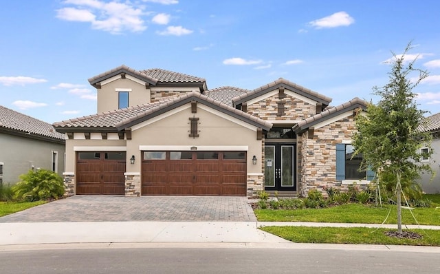 view of front of house featuring french doors, a front lawn, and a garage