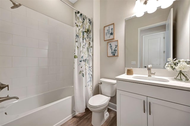 full bathroom with hardwood / wood-style floors, vanity, toilet, and shower / bath combo