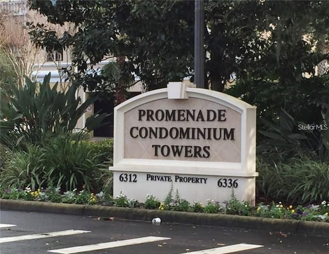 community sign with uncovered parking
