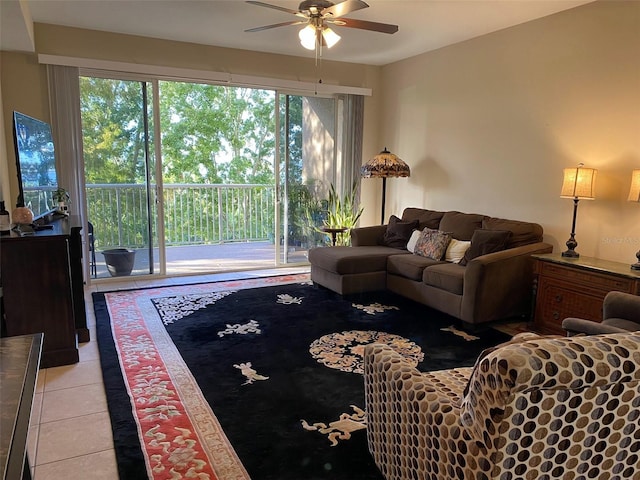 living room with a ceiling fan and light tile patterned floors
