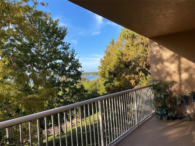 balcony featuring a water view