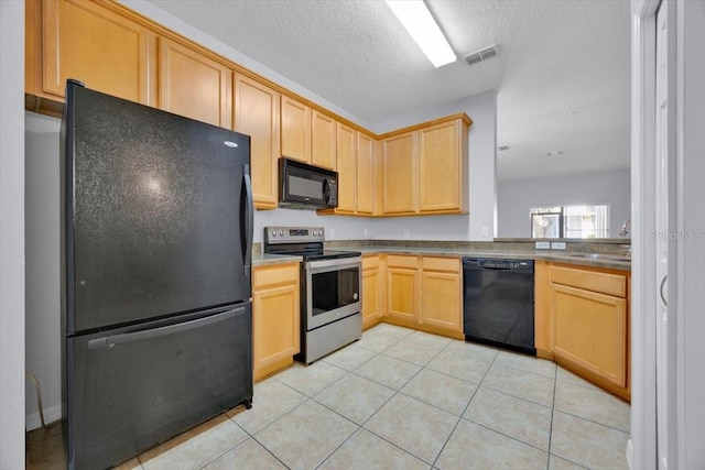 kitchen featuring sink, light tile patterned floors, light brown cabinets, and black appliances