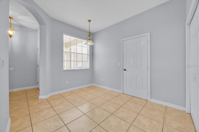 spare room featuring light tile patterned floors