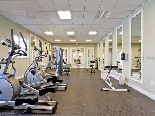 exercise room featuring a paneled ceiling