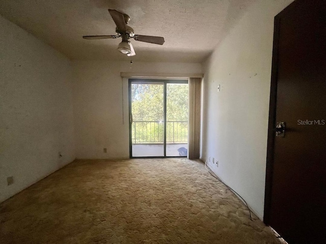 spare room with light carpet, a textured ceiling, and ceiling fan