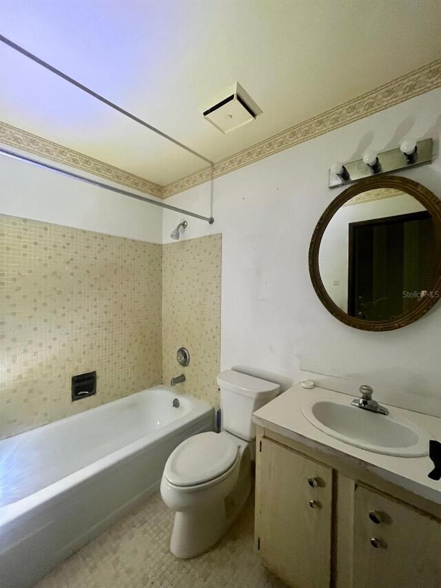 full bathroom with vanity, toilet, and shower / bathtub combination