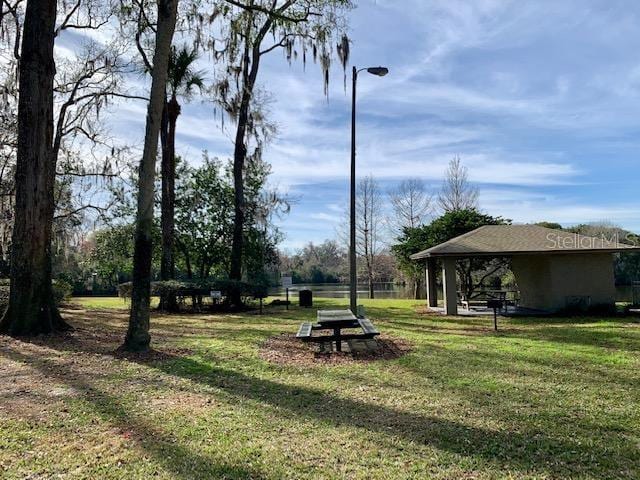 view of property's community with a lawn