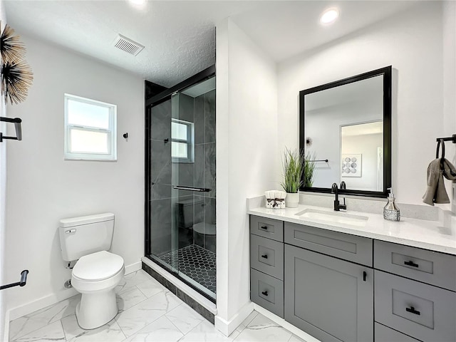 bathroom featuring toilet, a textured ceiling, walk in shower, and vanity