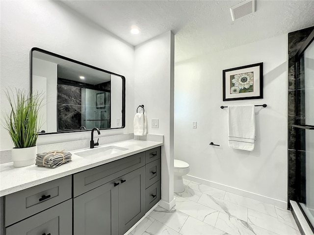 bathroom with vanity, a textured ceiling, toilet, and an enclosed shower