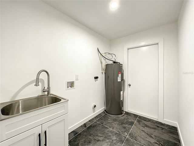 clothes washing area featuring hookup for a washing machine, sink, hookup for an electric dryer, electric water heater, and cabinets