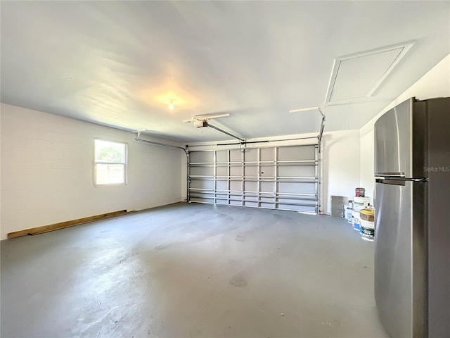 garage with stainless steel fridge