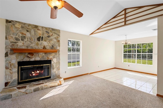 unfurnished living room featuring lofted ceiling, a fireplace, carpet flooring, and plenty of natural light