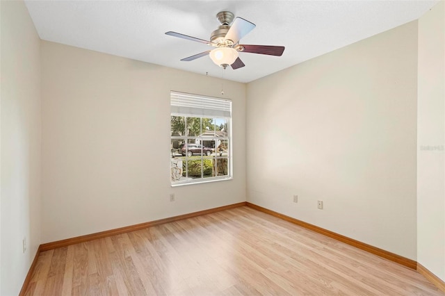 empty room with light hardwood / wood-style flooring and ceiling fan