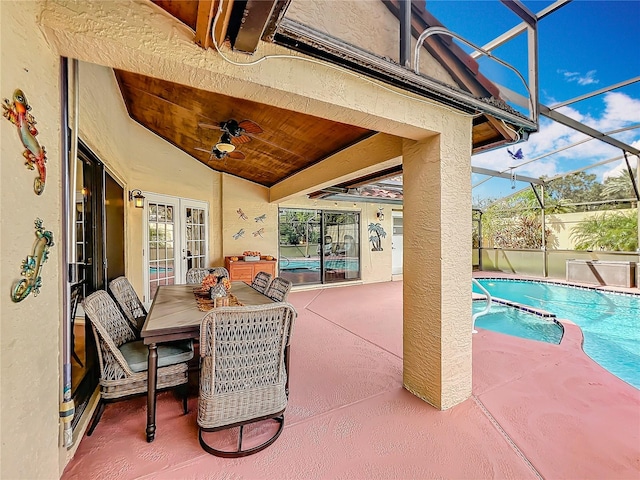 view of patio / terrace with a fenced in pool, a lanai, and ceiling fan