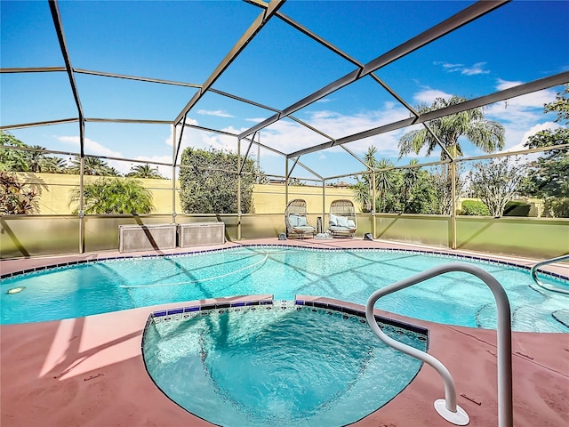 view of pool featuring glass enclosure