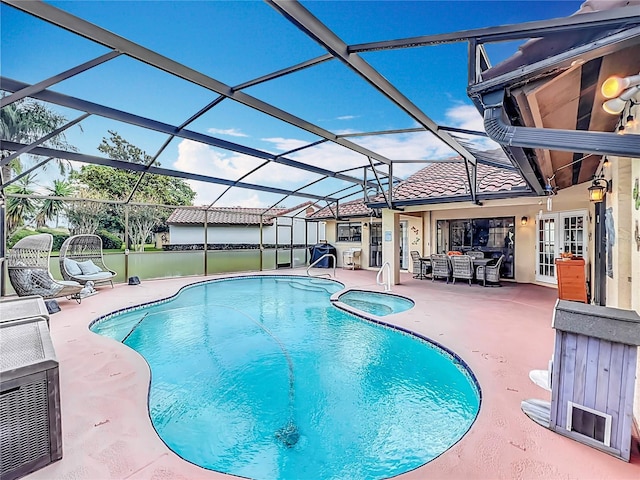 view of pool with a lanai and a patio