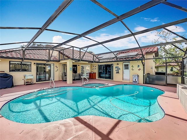 view of pool featuring a lanai, french doors, a patio, and an in ground hot tub