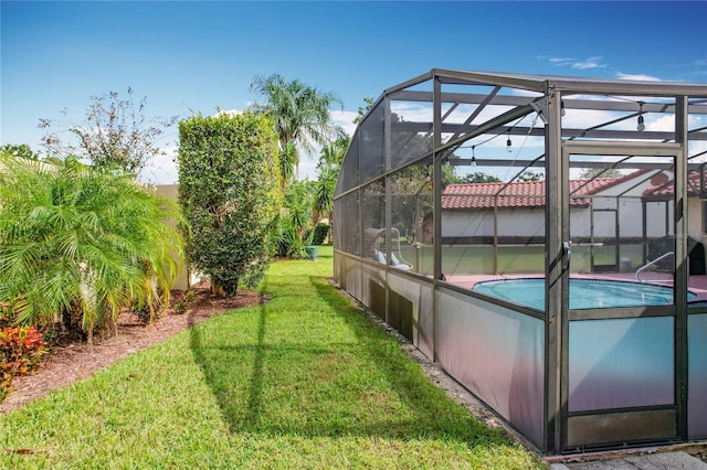 view of yard with a lanai