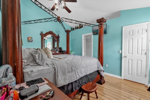 bedroom with wood-type flooring, lofted ceiling, and ceiling fan