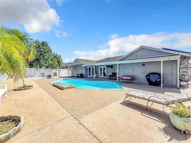 view of swimming pool featuring a patio area