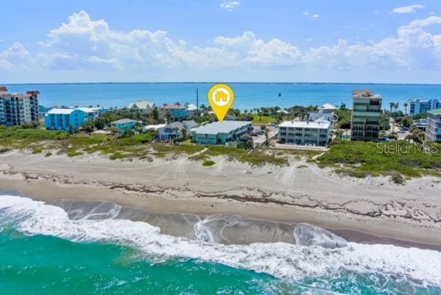 bird's eye view with a view of the beach and a water view