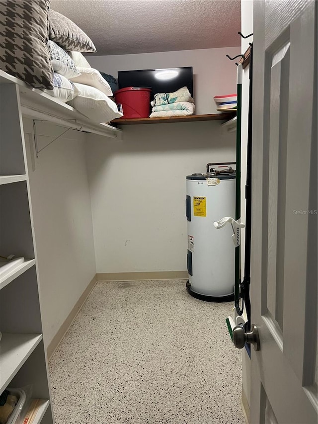 utility room with water heater