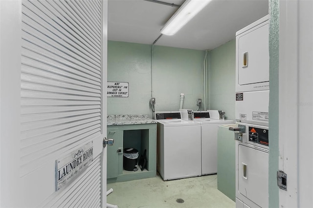 laundry area featuring washer and clothes dryer and stacked washer and clothes dryer