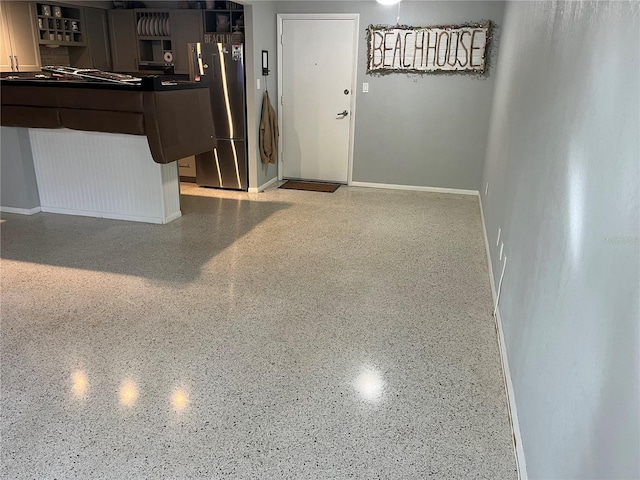 interior space featuring stainless steel fridge