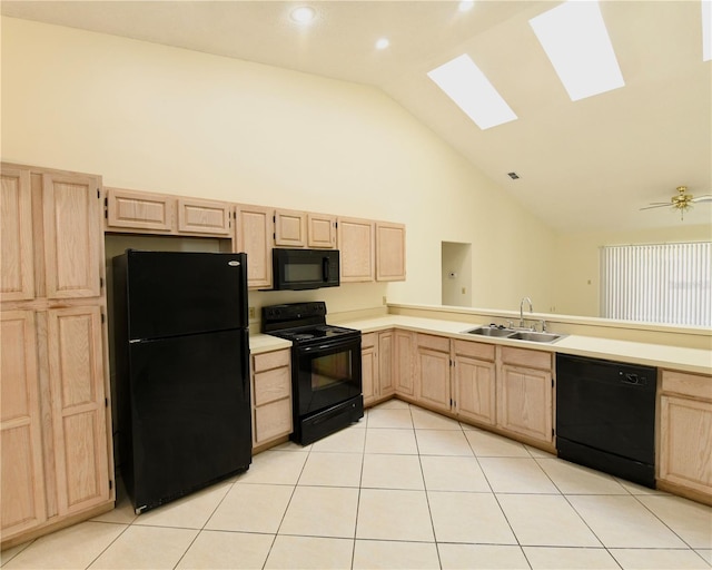 kitchen with black appliances, sink, and light brown cabinets