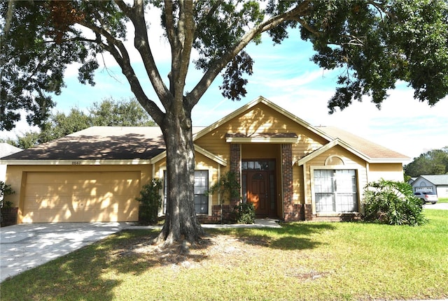 view of front of house featuring a front lawn and a garage