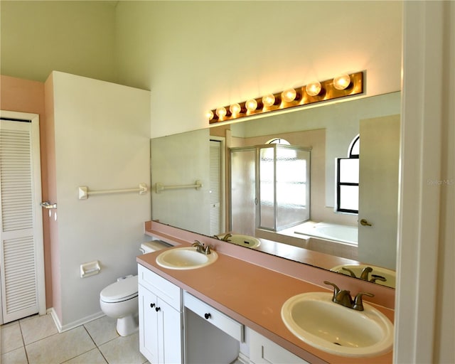 full bathroom featuring toilet, shower with separate bathtub, vanity, and tile patterned flooring