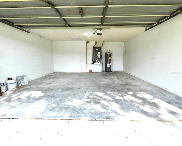 garage featuring a garage door opener and electric water heater