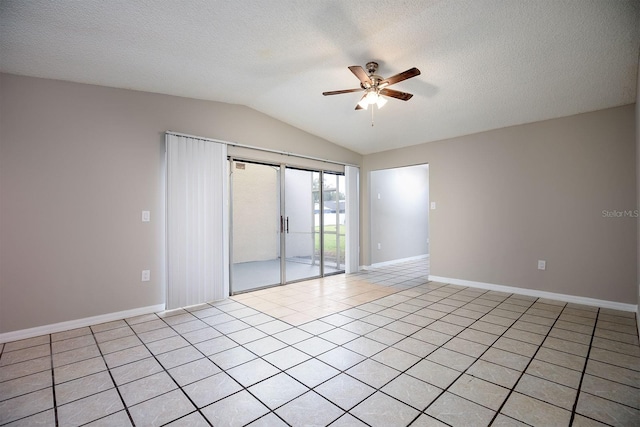 unfurnished room with vaulted ceiling, ceiling fan, light tile patterned floors, and a textured ceiling