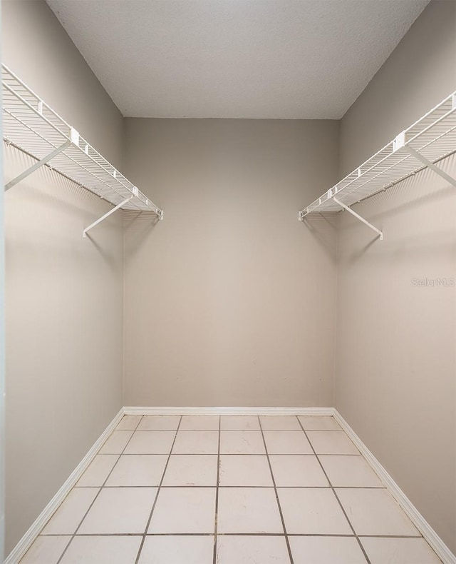 walk in closet featuring light tile patterned floors