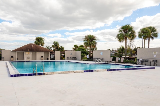 view of swimming pool featuring a patio area